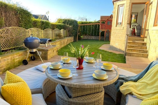A sheltered and private patio on which to enjoy the summer sun.