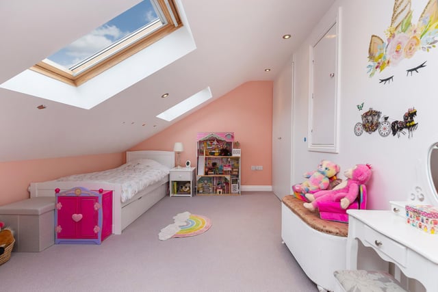 This child's bedroom is given character by the sloping roof.