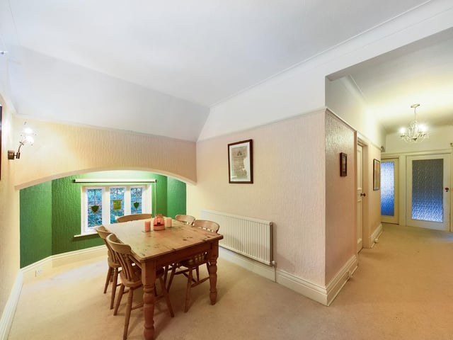 This area, used currently as a dedicated dining room, is flexible space.