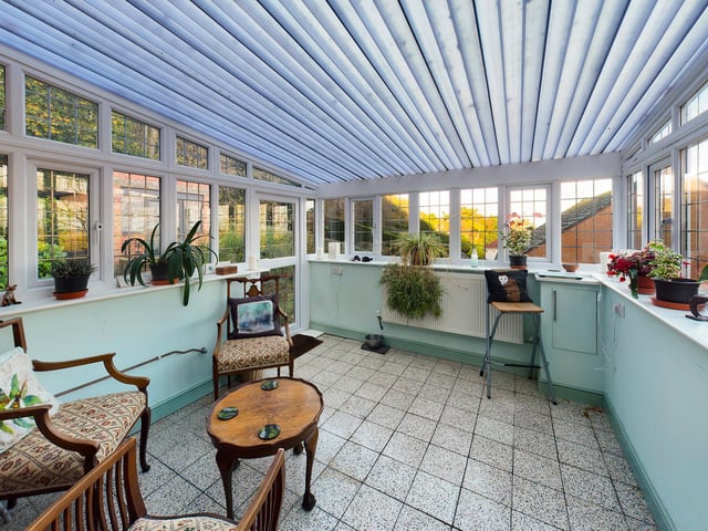 This is another spacious room, with a door leading outside.