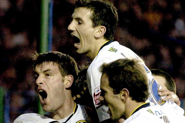 Paul Butler celebrates with teammates Liam Miller and Eddie Lewis after scoring against Sheffield Wednesday at Elland Road in January 2006. The Whites won 3-0.