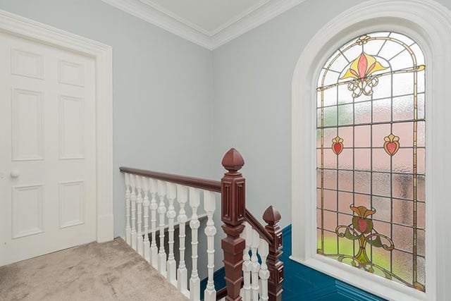 A colourful feature to the stairs and landing in the form of this stained glass window.