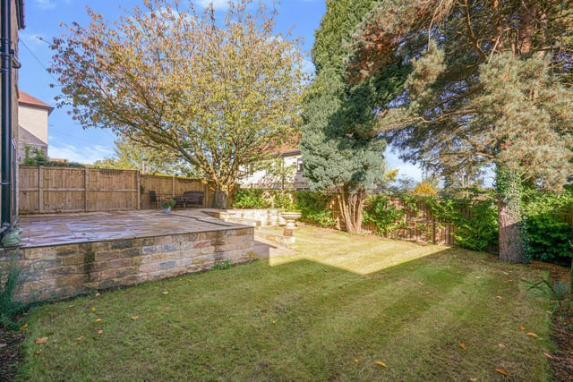 There is a substantial gravel drive to the front and an enclosed rear garden with an Indian stone terrace and a generous lawn.