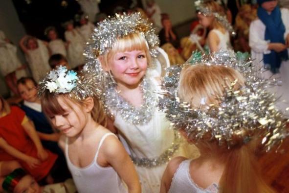 A pupil at Leeside J&I school, Wakefield, playing the role of the Little Angel at school's annual Christmas Nativity Play.