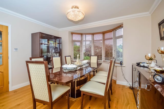 This room with a bay window has space for a large dining table and chairs.