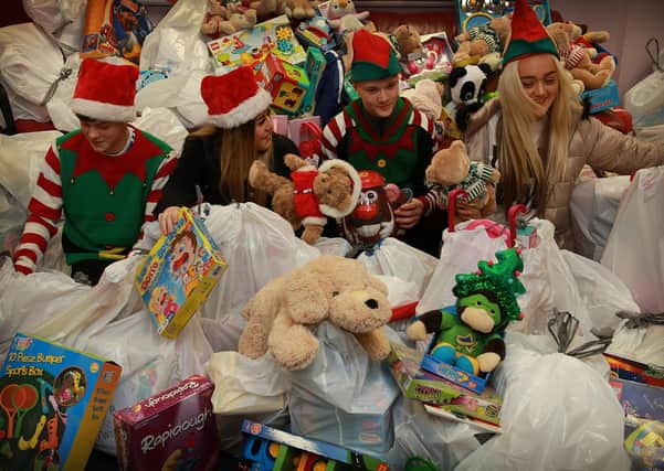 Goodtrees Neighbourhood Centre voulnters check out Christmas presents donated for vulnerable families after a festive appeal (Picture: Stewart Attwood)