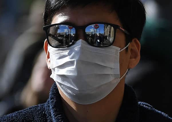 Just how useful are those face masks? (Picture: AFP/Getty)