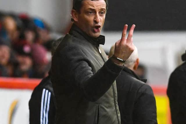 Hibs head coach Jack Ross issues some instructions to his players at Pittodrie. Pic: SNS