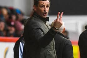 Hibs head coach Jack Ross issues some instructions to his players at Pittodrie. Pic: SNS