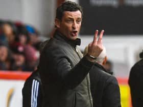 Hibs head coach Jack Ross issues some instructions to his players at Pittodrie. Pic: SNS