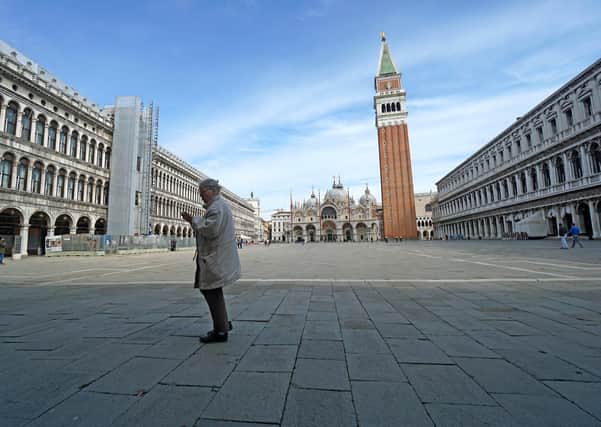 St Mark's Square in Venice, usually packed with tourists, is virtually deserted  (Picture: Anteo Marinoni/LaPresse via AP)