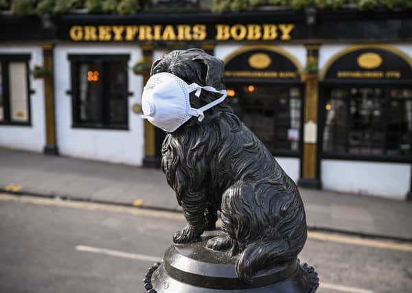 Even Greyfriars Bobby's got a mask on his face (Picture: Jeff J Mitchell/Getty Images)
