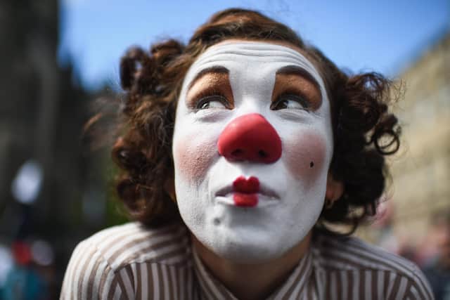 A Fringe entertainer performs on the Royal Mile (Picture: Jeff J Mitchell/Getty Images)