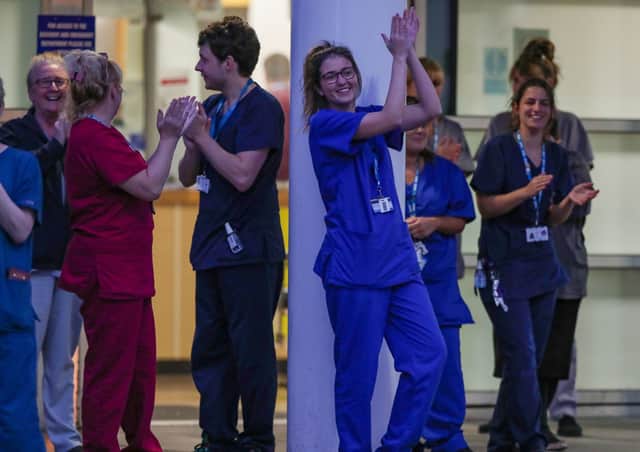 Hospital staff join in last week's national applause (Picture:  Peter Byrne/PA Wire)