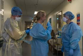 Medics prepare for a shift on the ICU