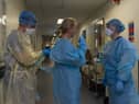 Medics prepare for a shift on the ICU
