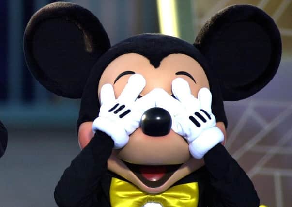 Mickey can’t bear to look as conspiracy theorists blame DisneyPlus for the pandemic (Picture: Getty)