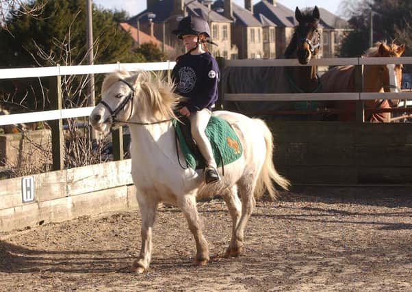 A young girl on her pony at Tower Farm Riding Stables in Edinburgh (Picture: Neil Hanna)
