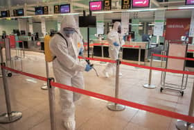 Disinfecting the departures terminal in Barcelona Airport. 
Picture: 
Isabel Infantes/Getty