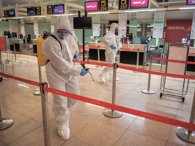 Disinfecting the departures terminal in Barcelona Airport. 
Picture: 
Isabel Infantes/Getty
