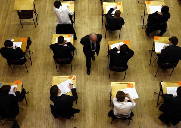 File photo dated 07/03/12 of a general view of pupils sitting an exam. GCSEs should be reformed or scrapped, according to a majority of school and college leaders polled by a teachers' union. PA Photo. Issue date: Friday March 13, 2020. More than four fifths of 799 respondents, or 86%, wanted the qualifications shaken-up or done away with altogether, according to a survey by the Association of School and College Leaders (ASCL). See PA story EDUCATION GCSEs. Photo credit should read: David Jones/PA Wire