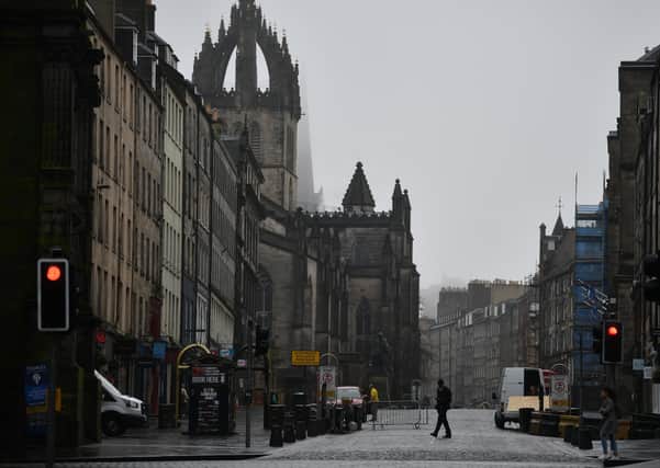 The Royal Mile is virtually deserted as people are asked to socially distance themselves amid the coronavirus outbreak (Picture: Jeff J Mitchell/Getty Images)