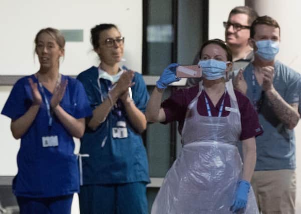 NHS staff join in last week's round of applause (Picture: Peter Byrne/PA Wire)