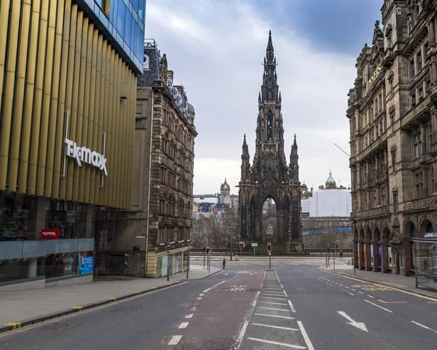 The streets of central Edinburgh may empty during lockdown, but the capital's economy continues to function. Picture: Mark Scates/SNS