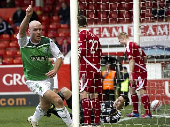 Sean OHanlon celebrates making it 2-0 to Hibs at Pittodrie from a Leigh Griffiths corner kick