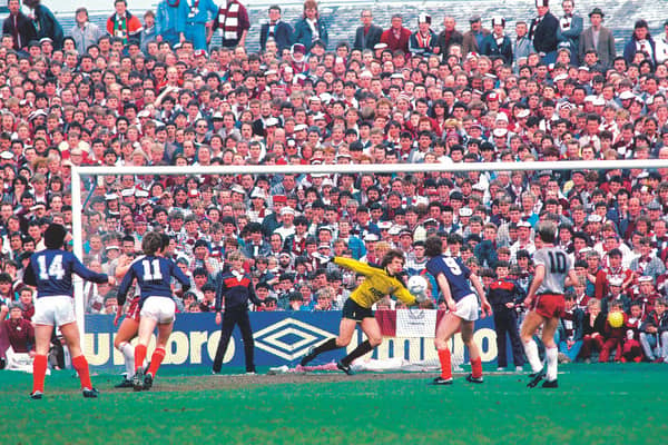 Dundee's Albert Kidd (No 14) delivered two devastating blows to Hearts' title bid. Picture: SNS