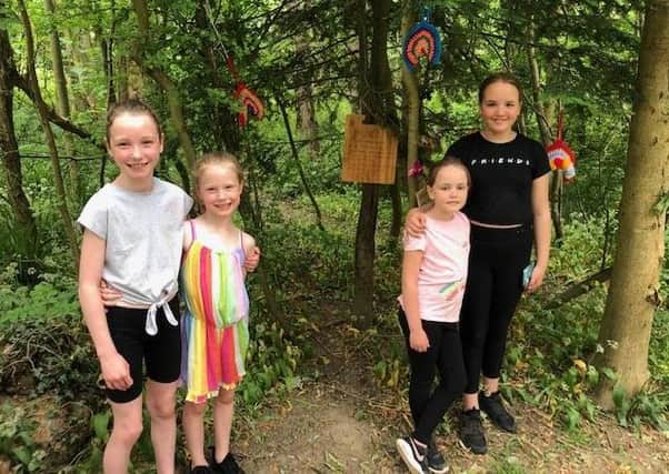 Two pairs of Sisters Lucy (grey top) and Sophie (rainbow top) Ward, Beth (black top) and Lily Thomson have created a magical A-Z Fairy trail starting at Newbatte Abbey.