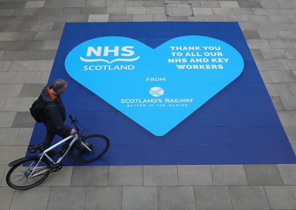 This tribute to the NHS at Waverley Station is another visibile reminder of the impact of the virus (Picture:: Andrew Milligan/PA Wire)