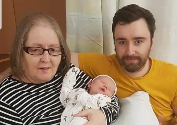 Margaret Laidlaw died after contracting Covid-19. She is pictured with her son Iain and grandson Lewis (Iain’s son).