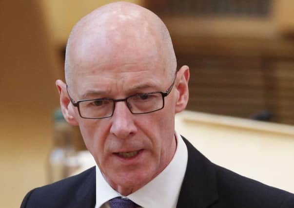 Education Secretary John Swinney has said schools will return full time with no social distancing if the Covid-19 coronavirus is suppressed (Picture: Andrew Cowan/Scottish Parliament/PA Wire)