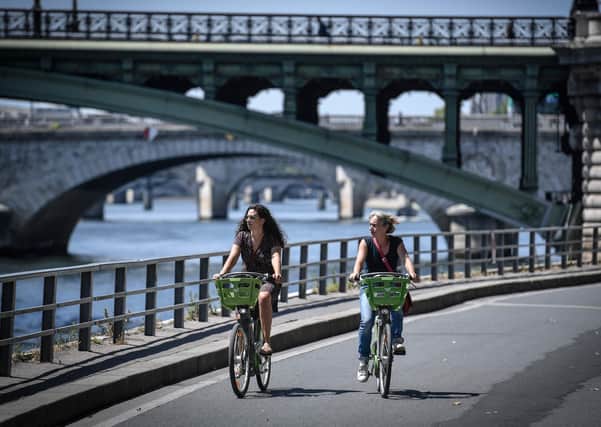 Cities such as Paris, above, have allocated miles of street space to people walking or cycling (Picture: Stephane de Sakutin/AFP via Getty Images)