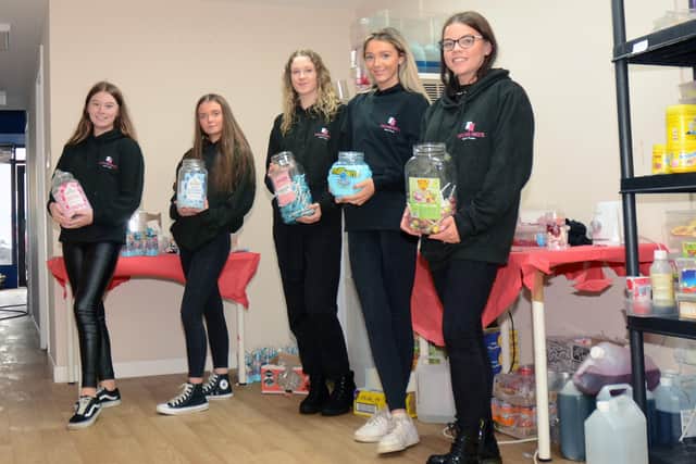 The Girls of Pentland Sweets prepare packages within their Penicuik base.