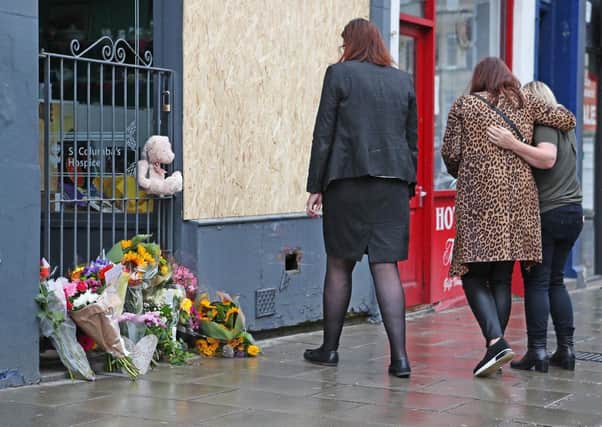 Flowers are laid at the scene where a three-year-old boy was killed when a car veered off the road (Picture: Jane Barlow/PA Wire)