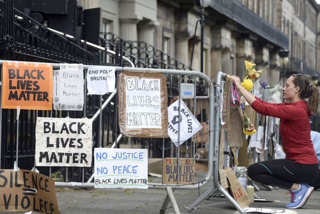 Posters and placards expressing anger at the death of George Floyd on railings outside the US Consulate in Edinburgh (Picture: Lisa Ferguson)