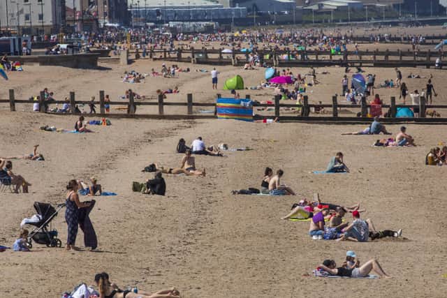 Crowds flocked to Portrobello Beach at the weekend as the sun shone (Picture: SWNS)