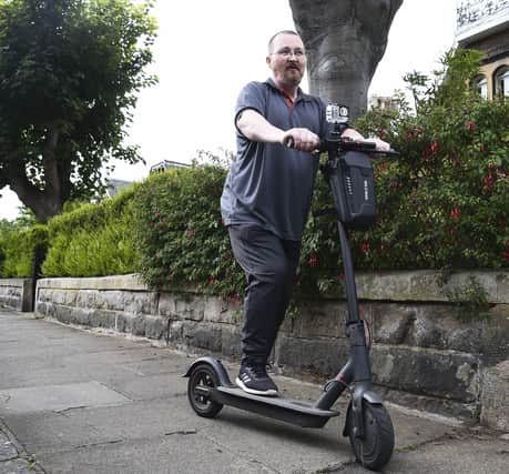 Chris Osborne has been charged over using his electric scooter on the pavement (Picture: Lisa Ferguson)