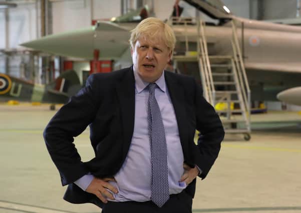 Boris Johnson in an aircraft hanger at RAF Lossiemouth (Picture: Andrew Milligan/PA Wire)