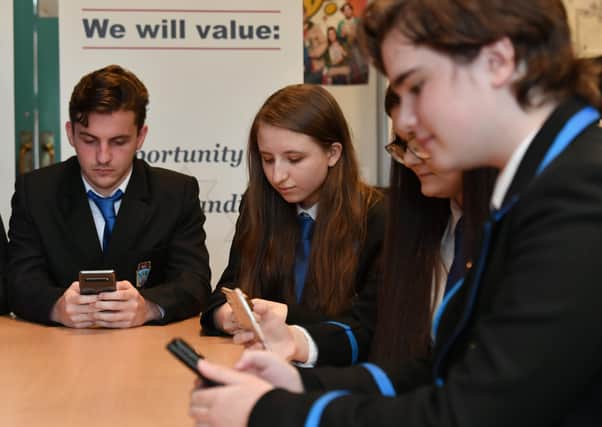Pupils check their email for their exam results from the SQA – many were set to be disappointed (Picture: John Devlin)