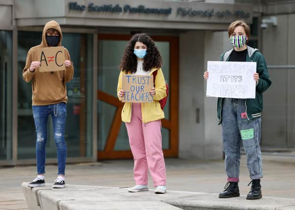 Pupils protest against the downgrading of marks at Holyrood (Picture: Jeff J Mitchell/Getty Images)