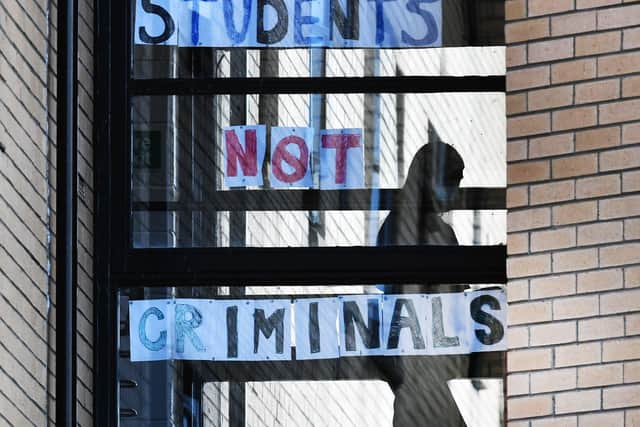 Students at Glasgow University's Murano Street residences make a point about their treatment (Picture: John Devlin)