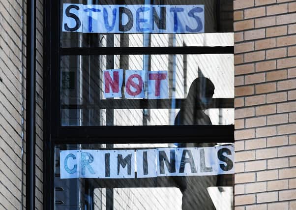 Students at Glasgow University's Murano Street residences make a point about their treatment (Picture: John Devlin)