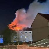 Six people were taken to hospital after a fire broke out in top story flat in Loanhead.