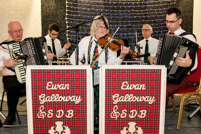 Ewan Galloway, pictured on the right hand side (red trousers, playing accordion) with his band, has been entertaining music fans across the world during lockdown.