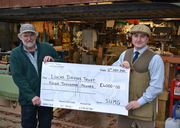 Jamie Goodall, Head Keeper on the Kettleshiel Estate, presenting Rick Davies with a Cheque for £4000 towards the purchase and installation of a stair lift.