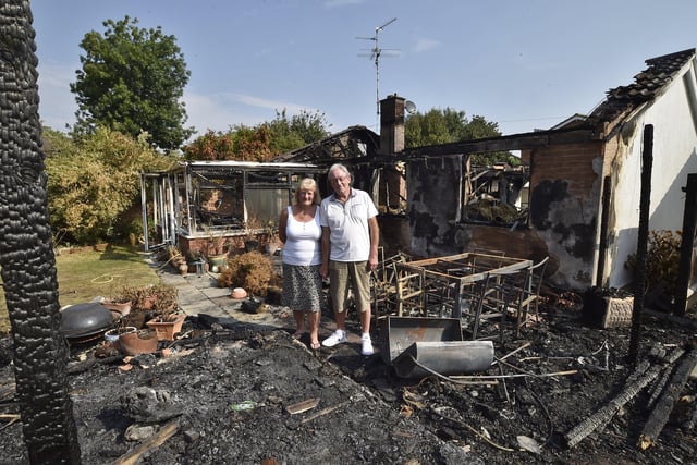 Bungalow fire at Beech Close, Market Deeping. Dave Turner  and Olwyn Cornwell amongst the remains of their home. EMN-201208-122057009
