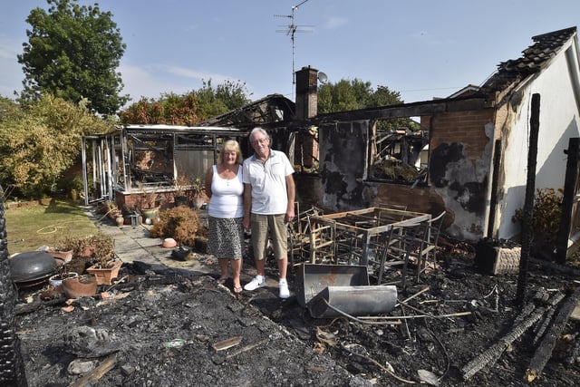 Bungalow fire at Beech Close, Market Deeping. Dave Turner  and Olwyn Cornwell amongst the remains of their home. EMN-201208-122045009